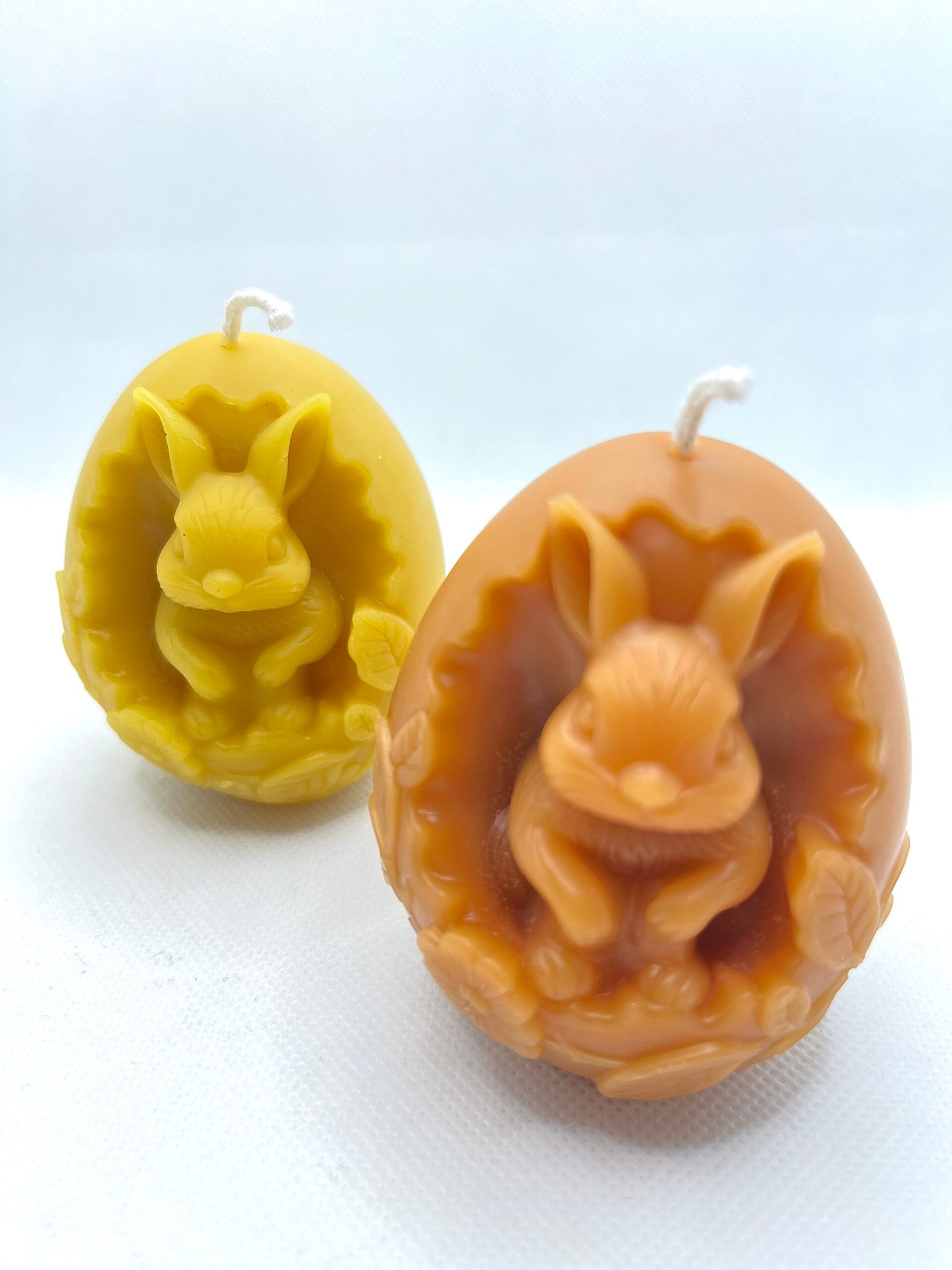 Botanical artichoke-form beeswax candle with plant dyes.
