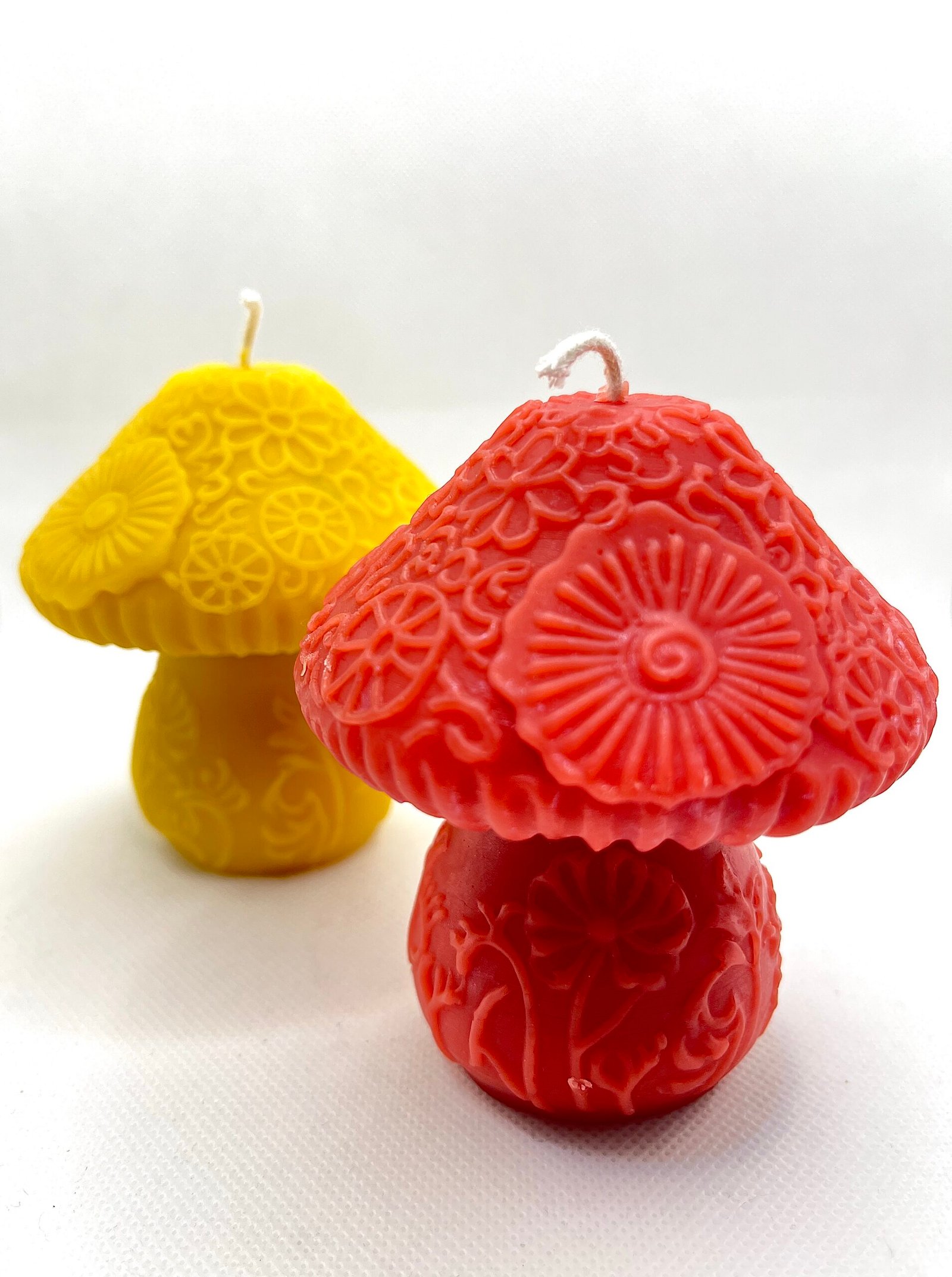Yellow tulip blossoming from an egg-shaped beeswax candle.
